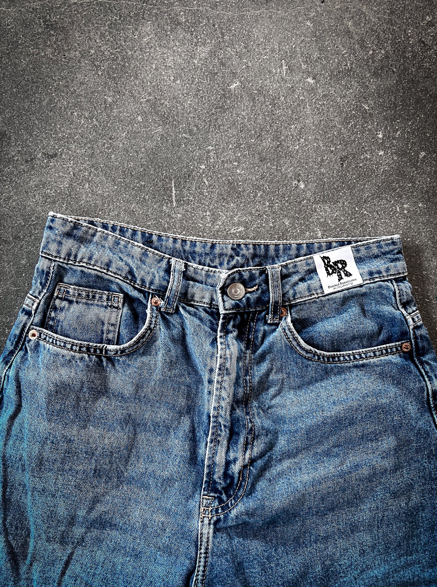 Asymmetrical Bleached Jeans